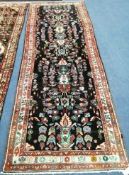 A Hamadan carpet 316 x 107cm