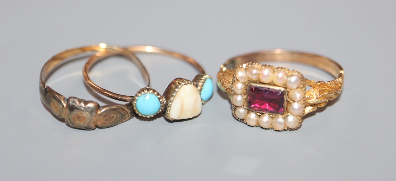 An early Victorian yellow metal, foil backed garnet? and split pearl ring and two other rings.