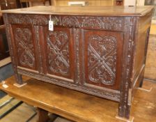 An 18th century and later carved oak coffer W.118cm