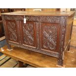 An 18th century and later carved oak coffer W.118cm