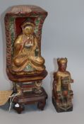 A carved wood Buddha on a shrine together with another wooden carving height 36cm