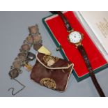 A gentleman's early 20th century 15ct gold manual wind wrist watch and a coin bracelet.