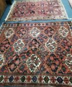 Two North West Persian red ground rugs Larger 206 x 166cm