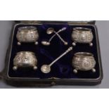 A cased set of four Victorian silver salts by George Unite, Birmingham, 1881, with one original