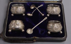 A cased set of four Victorian silver salts by George Unite, Birmingham, 1881, with one original