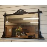 A late Victorian aesthetic movement ebonised overmantel mirror W.112cm