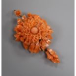 A yellow metal and carved coral flower head drop pendant brooch, overall approx. 8cm.