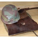 A WWII German ruck-sack helmet, close combat clasp