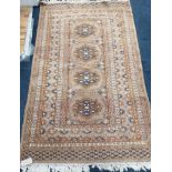 A Bokhara fawn ground rug 154 x 96cm