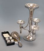 A plated four-trumpet epergne, a set of four silver napkin rings, cased and a silver-mounted brush