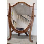 An Edwardian mahogany shield-shaped toilet mirror H.76cm