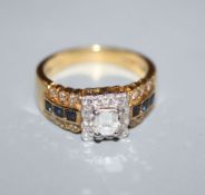 A modern 18ct gold and diamond square cluster ring, with sapphire and diamond set shoulders, size