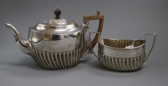 A silver teapot of oval half-fluted form and a matching sucrier, London 1900, maker Samuel Walton