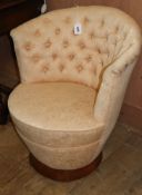 An Art Deco style button back upholstered tub chair