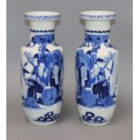 A pair of late 19th century Chinese blue and white vases, bearing Kangxi mark height 29.5cm