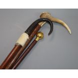 Two horn / antler canes and a swagger stick