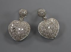 A pair of modern 18k and pave set diamond heart shaped drop earrings, overall 25mm.
