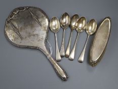 A set of four silver teaspoons, another teaspoon, a silver hand mirror mount and a silver-mounted