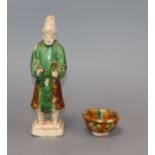 A Chinese green and rust glazed figure and a similar cup, Ming and Tang dynasty