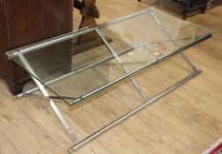 A contemporary glass and chrome X-frame rectangular coffee table W.142cm