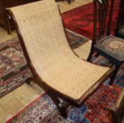 A caned hardwood plantation chair