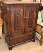 An oak linenfold two door cabinet W.85cm