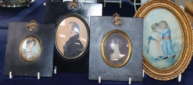 A 19th century miniature profile portrait of a gentleman, two portraits of ladies and a