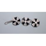 A pair of white metal, black onyx and diamond set octagonal cufflinks, one hallmarked platinum,