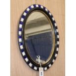 A small Irish style oval wall mirror H.49cm