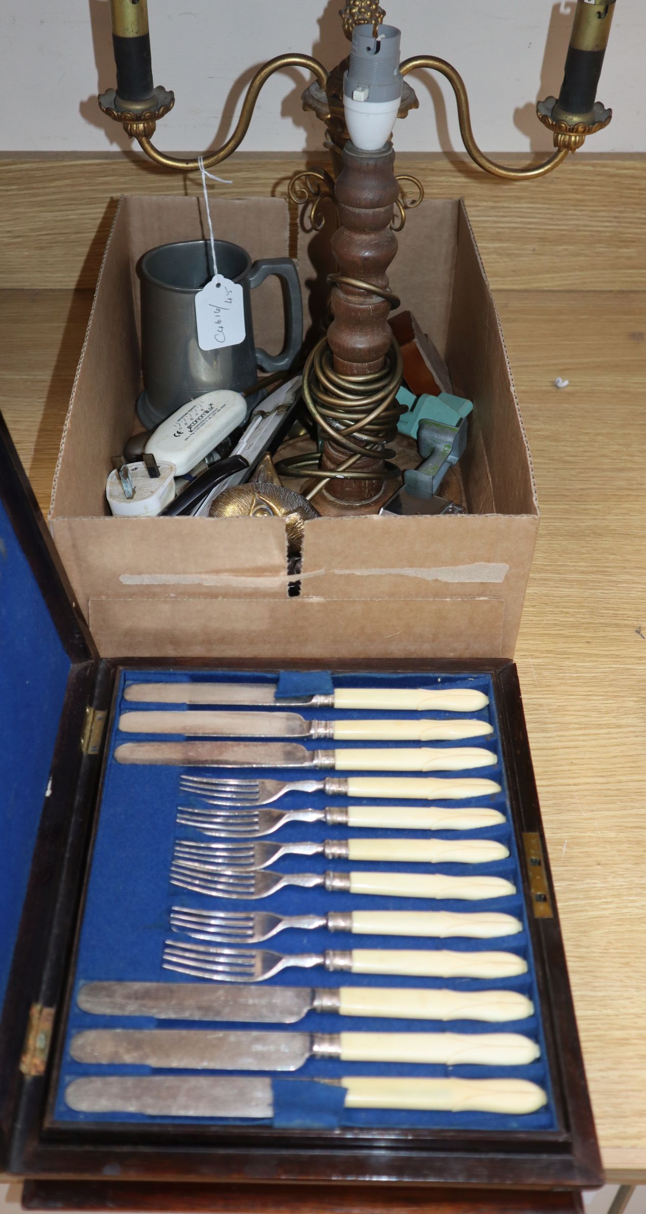 A cutlery box of fruit eaters, a lamp and mixed collectables