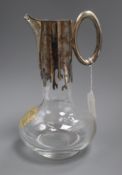 A Mappin & Webb Silver Jubilee commemorative silver mounted glass claret jug, with gilded crest,