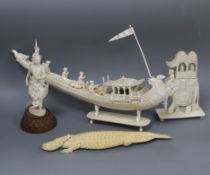 A group of Indian ivory models including a boat and a caparisoned elephant together with a Thai