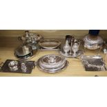 A collection of silver plate including revolving breakfast dish, entree dishes, cream and sugar on