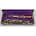 A rosewood clarinet by M. Barr, Victoria St, London, nickel-mounted, cased (mouthpiece a.f.)