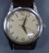 A gentleman's steel Eterna-Matic manual wind wrist watch, with date aperture, on brown leather