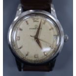 A gentleman's steel Eterna-Matic manual wind wrist watch, with date aperture, on brown leather