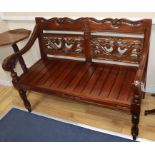 A reproduction carved hardwood bench W.120cm