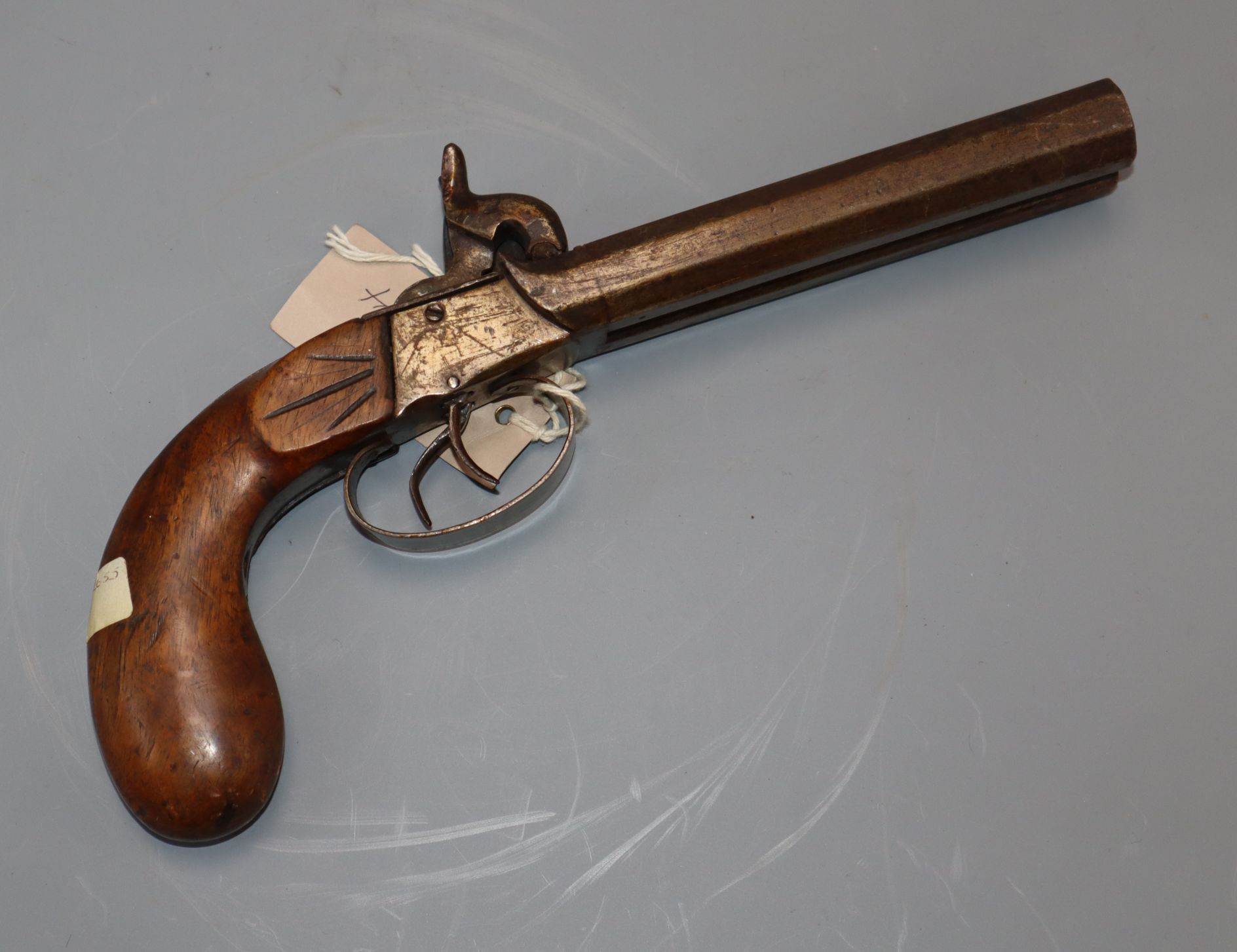 A rare left handed double barrelled percussion cap side-by-side pistol