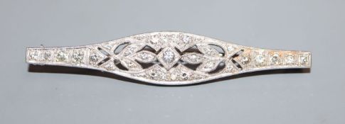 A 1920's pierced white metal and diamond set bar brooch, 54mm.