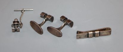 A pair of Georg Jensen sterling cufflinks and dress stud, design no. 67 and a similar tie clip,