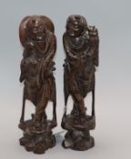 A pair of Chinese hardwood and wire figural carvings