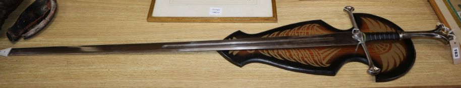 A mounted model of Aragons sword for model of 'The one ring' for Lord of the Rings sword length