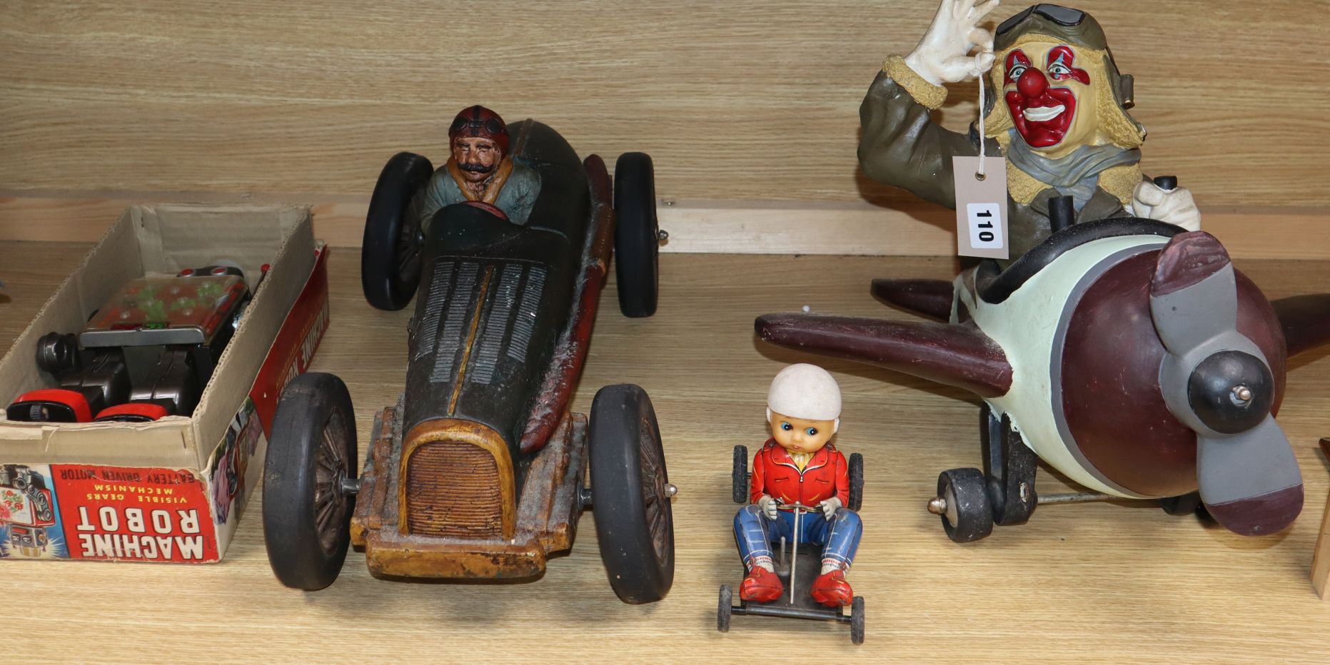 A "Machine robot" toy, boxed, a tin plate racer, a clown pilot and a similar car