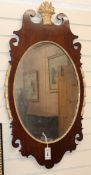 A mahogany and parcel gilt oval fret cut wall mirror H.98cm