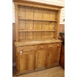 A 19th century pine dresser and rack W.144cm