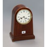 A French inlaid mahogany arched mantel clock