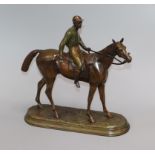 A painted spelter model of a jockey and horse, signed C. Valton height 30cm