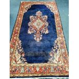 A North West Persian blue ground hall carpet 245 x 128cm