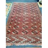 A Bokhara red ground small carpet 250 x 160cm