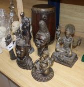 Two Benin style bronze heads, an African hardwood drum, two modern Maasai resin figures and two